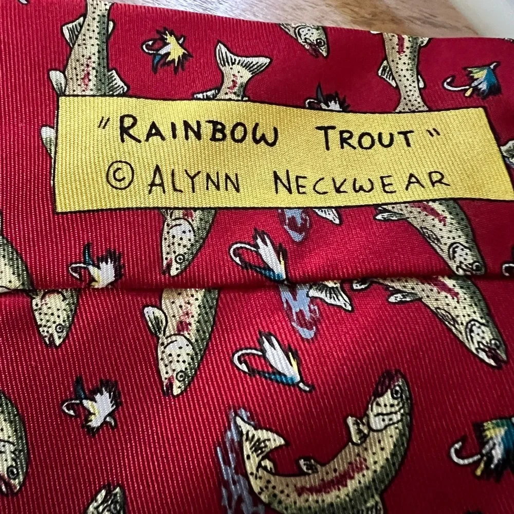 Rainbow trout neck tie by Alynn Neckwear. It is red with rainbow trout.